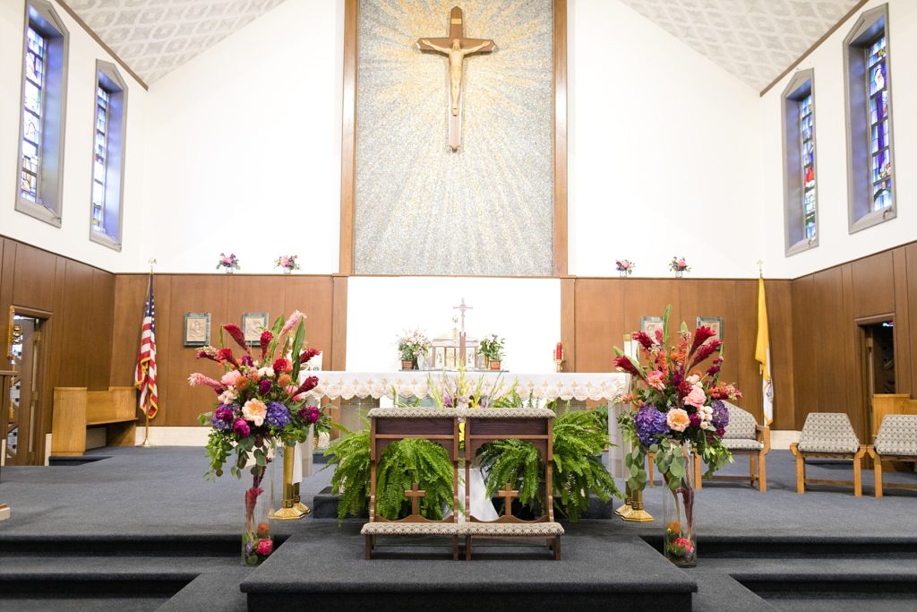 altar decorations at Immaculate Conception in Eau Claire by Allure Premiere Event Florists