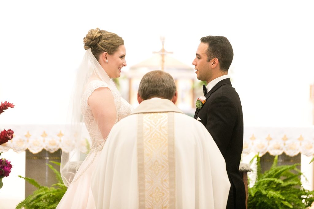 Emily & Michael exchange their vows at Immaculate Conception in Eau Claire