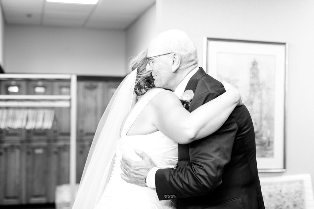 bride and father seeing each other for the first time at the Eau Claire Golf & Country Club
