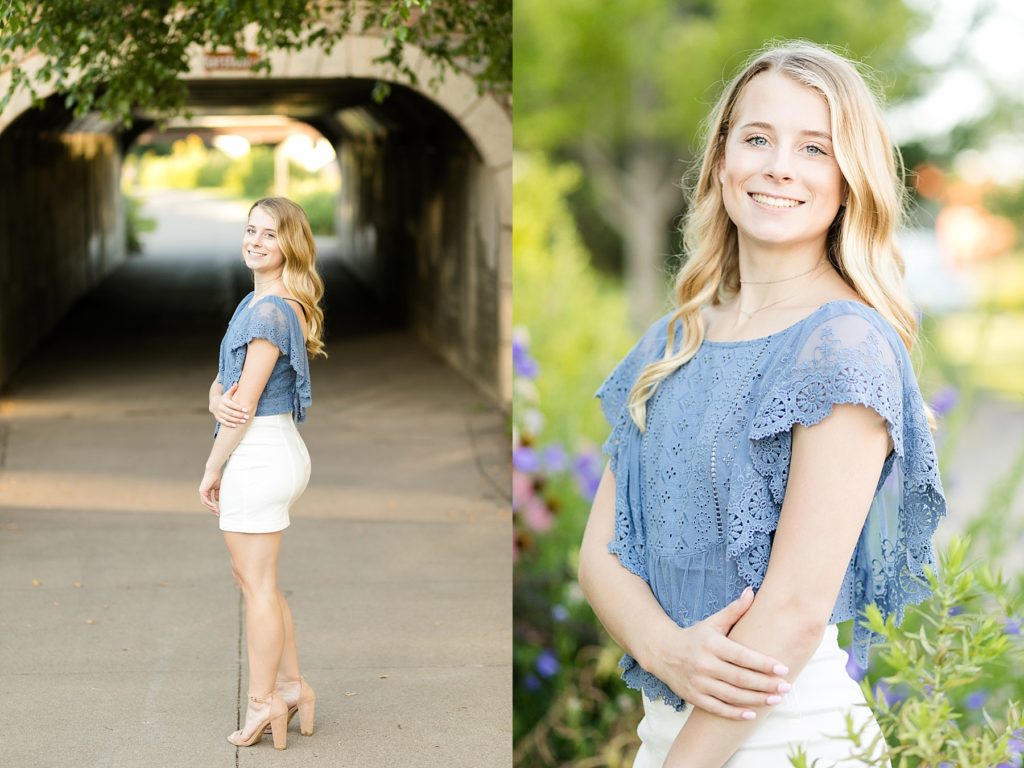 girl in a white skirt and blue top in flowers near a tunnel in Eau Claire for senior photos