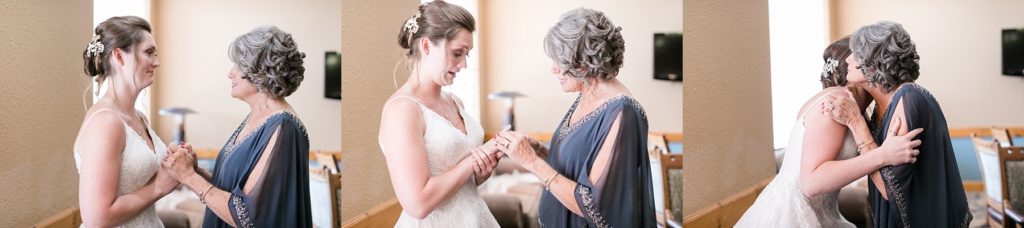 grandmother giving granddaughter a ring to wear on her wedding day at the Glacier Canyon Conference Center for a wedding at the Wilderness Resort in Wisconsin Dells
