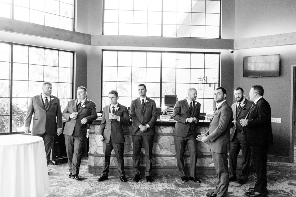 groom and groomsmen waiting for the wedding ceremony to start at the Glacier Canyon Conference Center for a wedding at the Wilderness Resort in Wisconsin Dells