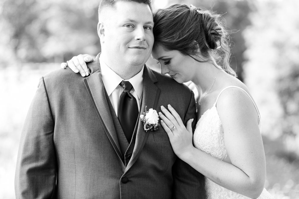 close up black and white photo of a couple in a quiet moment on their wedding day at the Glacier Canyon Conference Center for a wedding at the Wilderness Resort in Wisconsin Dells