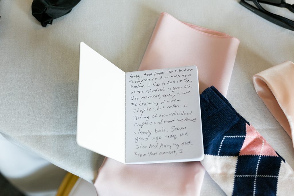 grooms vows in a booklet on a table at Lake Wissota Golf & Events