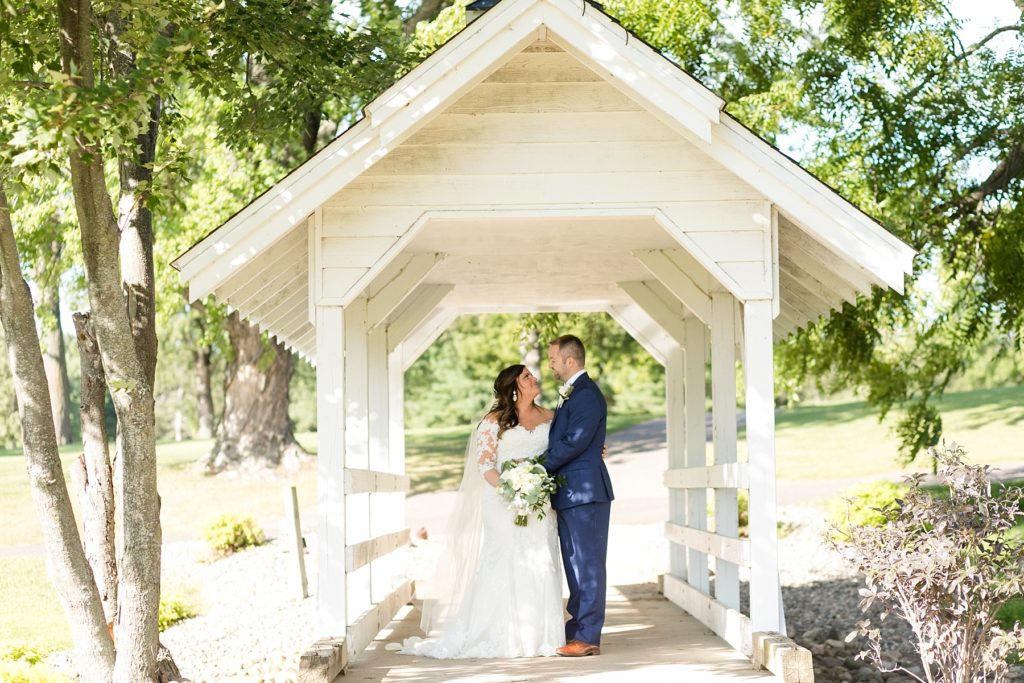 couple on the white bridge at Lake Wissota Golf & Events
