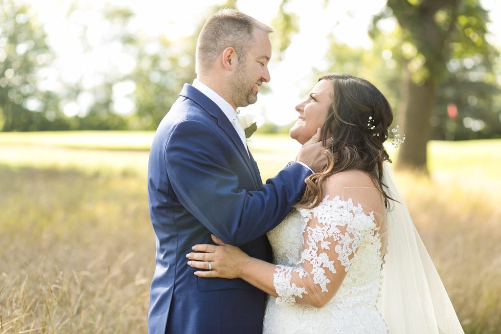 couple looking into each others eyes at Lake Wissota Golf & Events