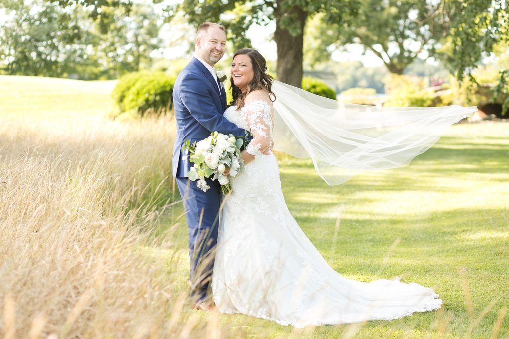 brides veil blowing in the wind at Lake Wissota Golf & Events
