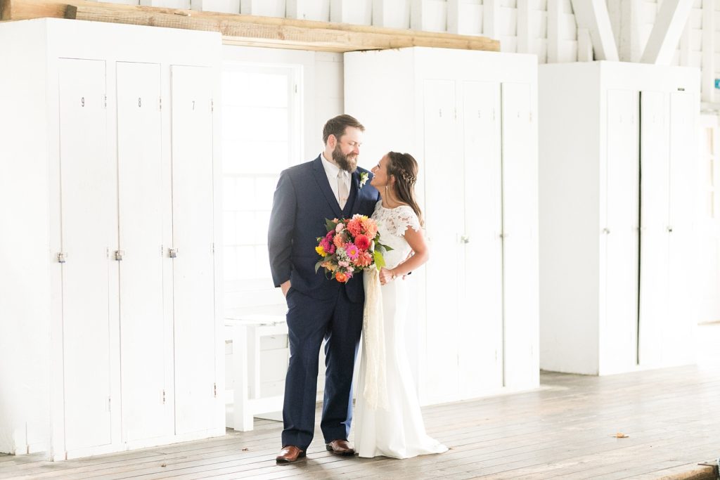 bride and groom in the boathouse at The Beacons of Minocqua on their wedding day