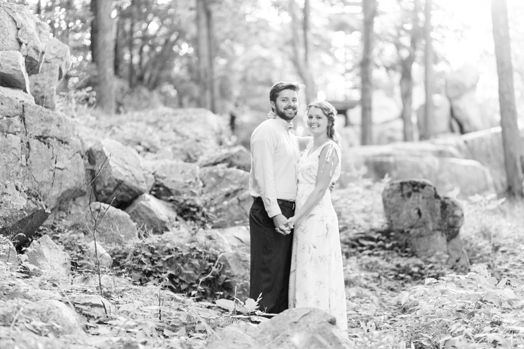 couple looking at camera at Rib Mountain State Park in Wausau for their engagement pictures