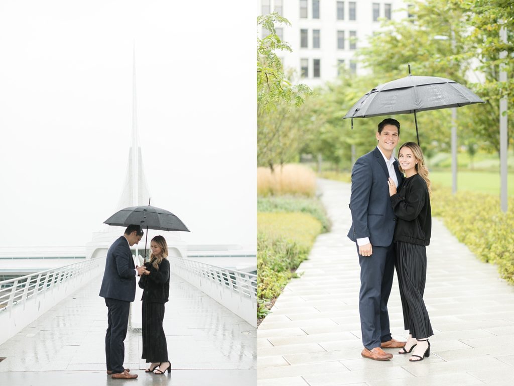 couple looking at the ring under an umbrella after he proposes in the rain at the Milwaukee Art Museum