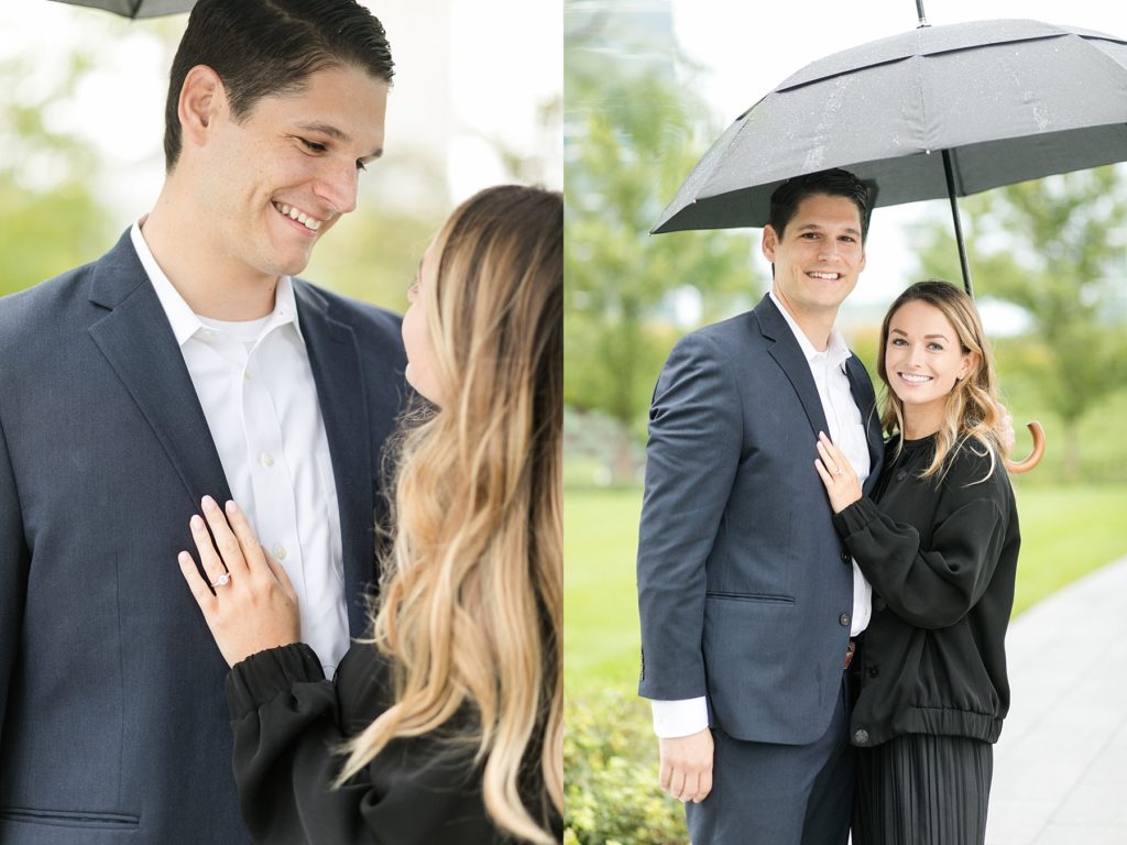 couple in the rain under an umbrella outside after he proposes at the Milwaukee Art Museum