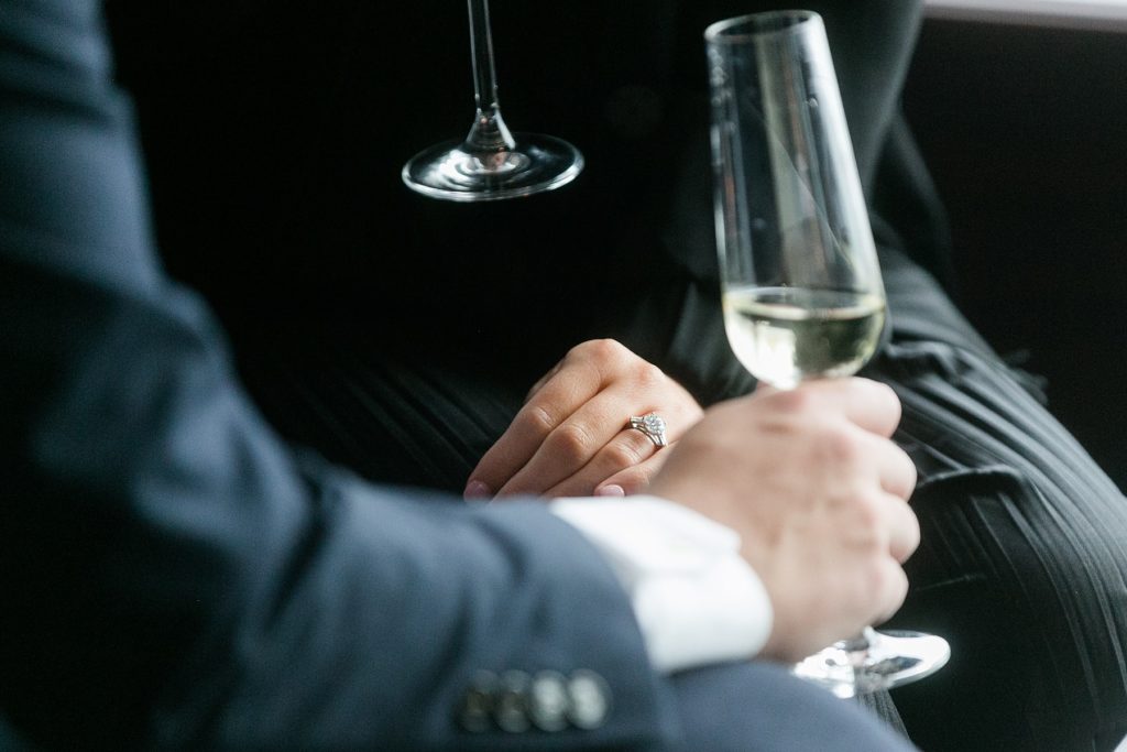 couple share a glass of champagne after she said yes to his proposal in Blu at the top of the Pfister Hotel in Milwaukee