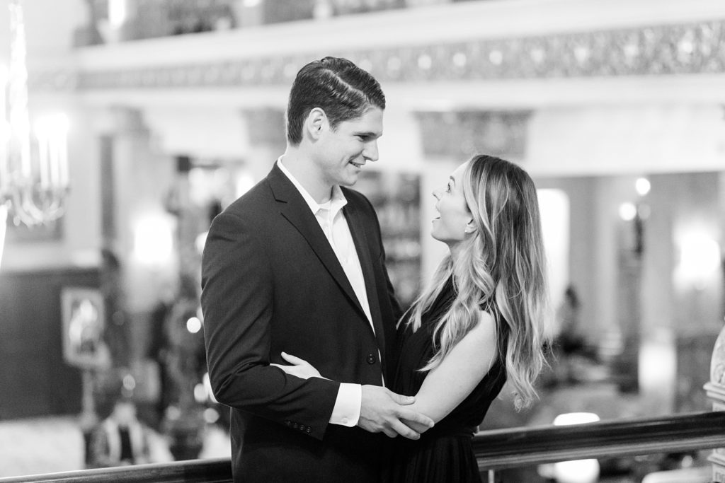 couple in the Pfister Hotel after he proposes at the Milwaukee Art Museum