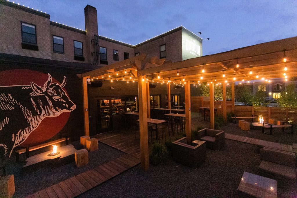 night photo of the patio at The Oxbow Hotel