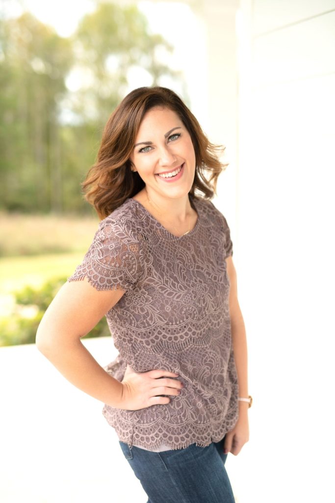 Christy Janeczko smiling in a purple shirt is a Wisconsin wedding and senior photographer