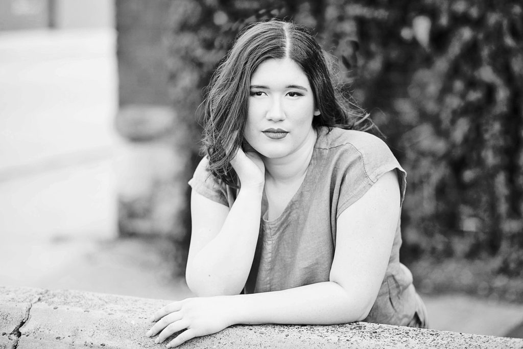 girl in a black and white photo not smiling in Eau Claire for her laid back senior photos