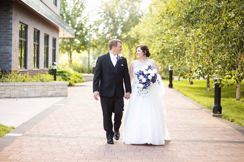 couple walking at Eau Claire micro wedding in Phoenix Park