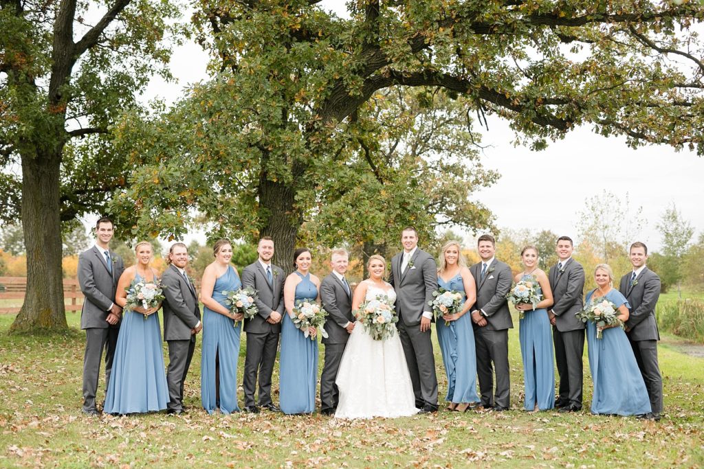 bridal party outside at their fall wedding at Lilydale in Chippewa Falls