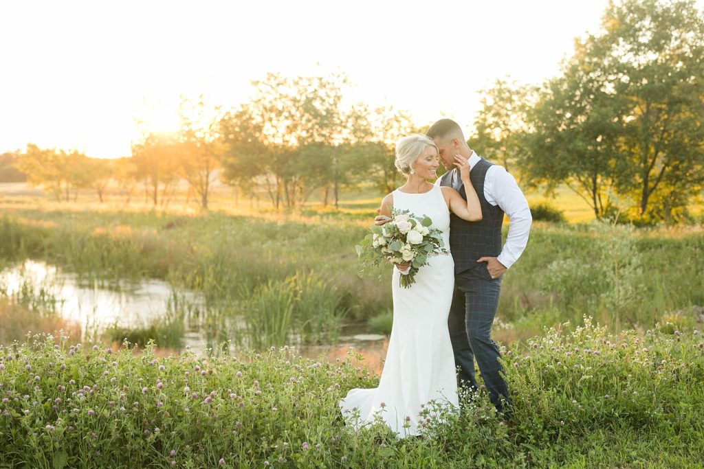 couple at sunset in the field at Lilydale Event Venue in Chippewa Falls