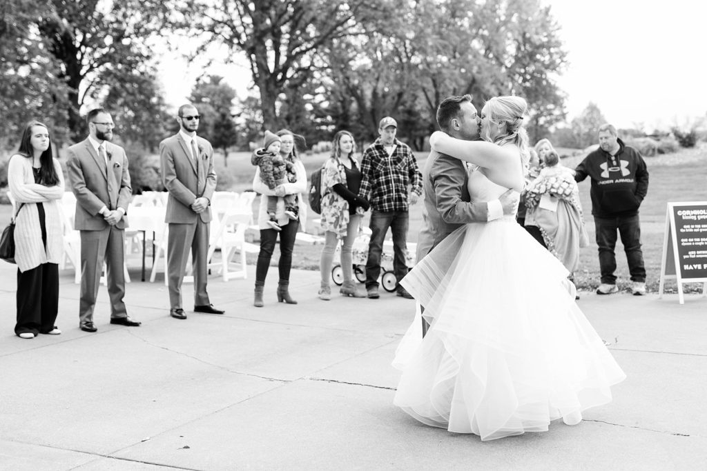 black and white photo of the first dance on the patio at a wedding at Lake Wissota Golf & Events