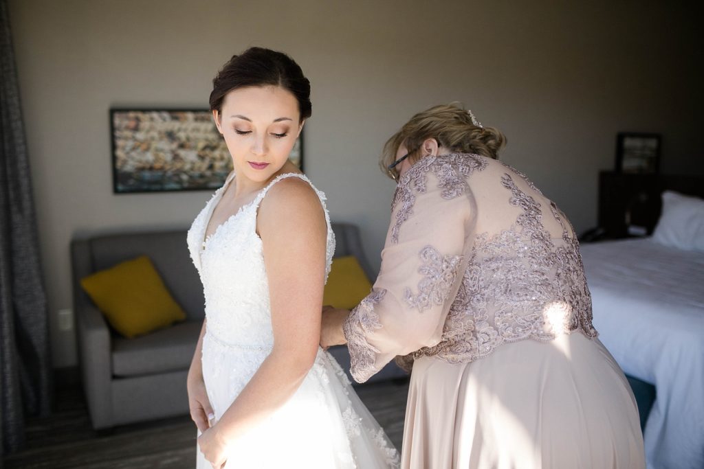 bride getting ready in a hotel in Wausau before her stunning wedding in Marathon, WI