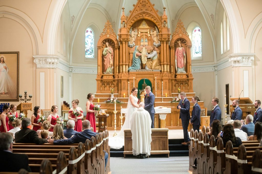 bride and groom at stunning wedding in Marathon, WI at St. Mary's Catholic Church