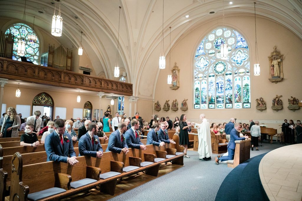 communion during a wedding ceremony at stunning wedding in Marathon, WI at St. Mary's Catholic Church
