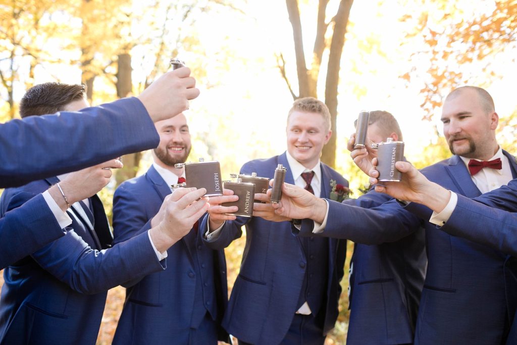 groomsmen toasting at Rib Mountain in Wausau at a fall wedding 